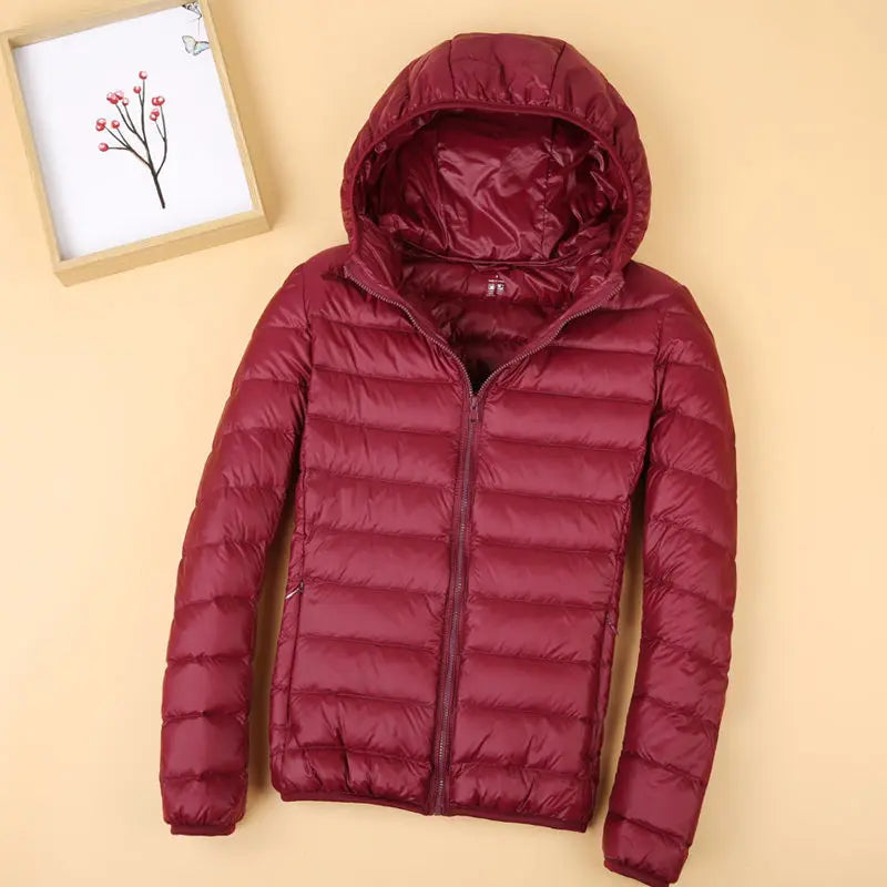 Autumn and Winter Women's Hooded Down Jacket 2026 New Simple Fashion Solid Color Elegant Commuter Mother Outdoor Jacket